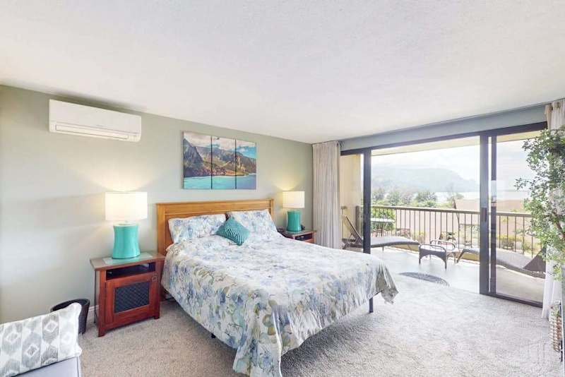 Wake refreshed in this peaceful bedroom with beautiful outdoor views