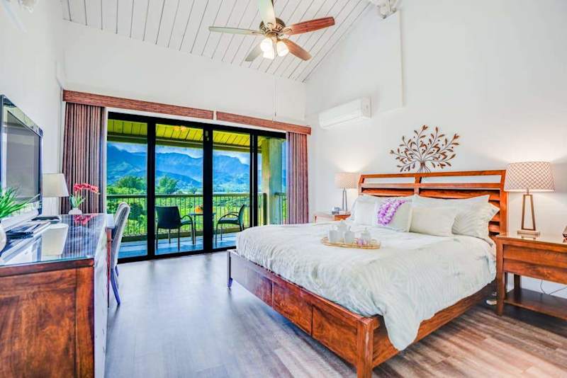 Rest peacefully in this bright bedroom with refreshing outdoor views