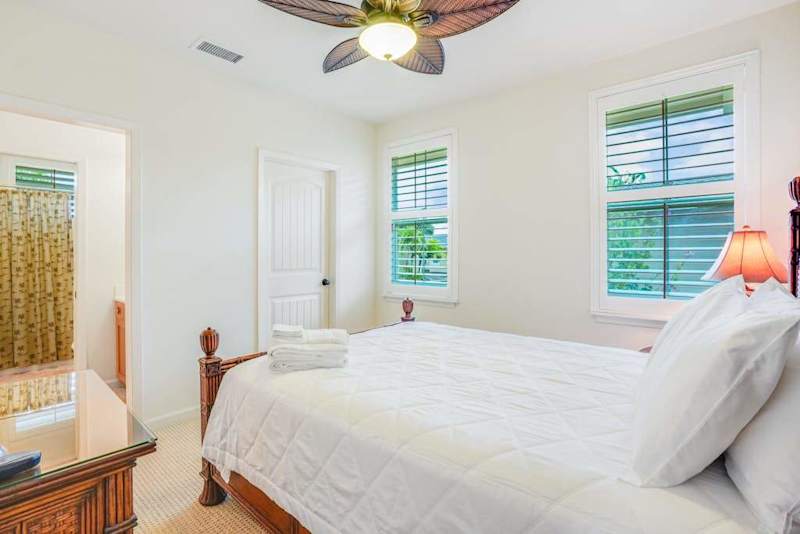 Guest bedroom with queen bed and en-suite bathroom.