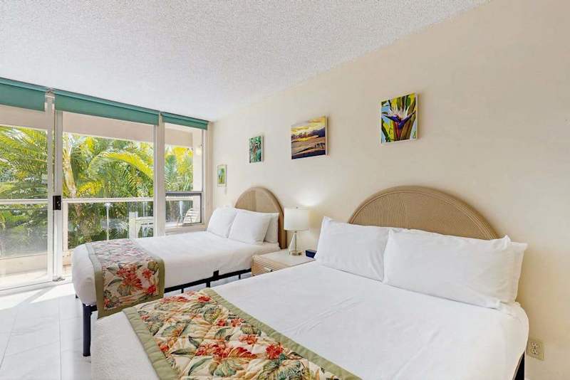 Cozy bedroom with peaceful garden views and two double beds