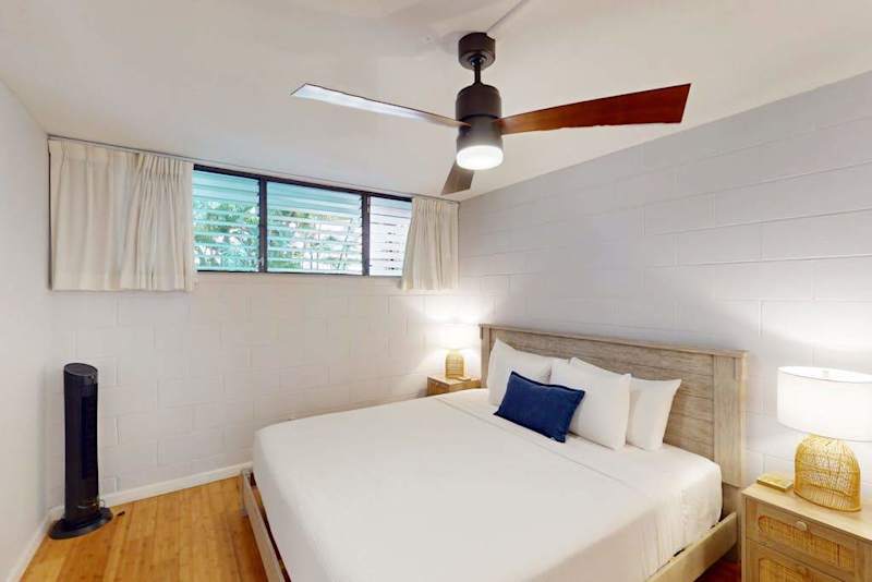 Peaceful Guest Bedroom with Plush Queen Bed & Ceiling Fan