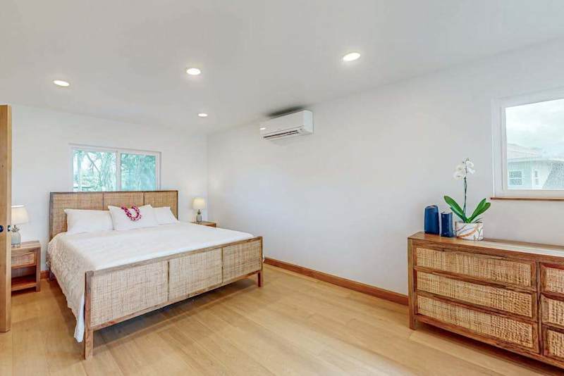 Second Bedroom features king bed dresser and soft natural window light