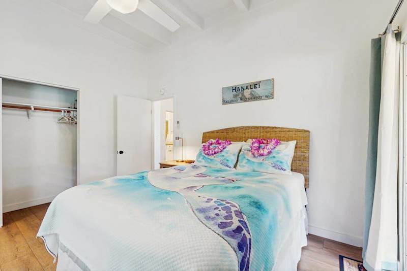 Inviting sleeping area pairs plush bedding with thoughtful touches and restful ambiance