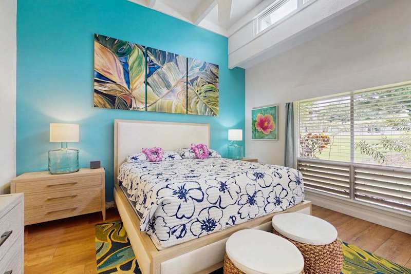 Peaceful sleeping space features comfortable bedding, tasteful furnishings, and soothing decorative touches