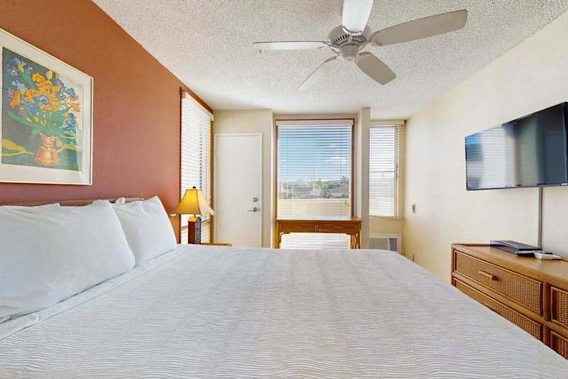 Bright Guest Bedroom With Smart TV