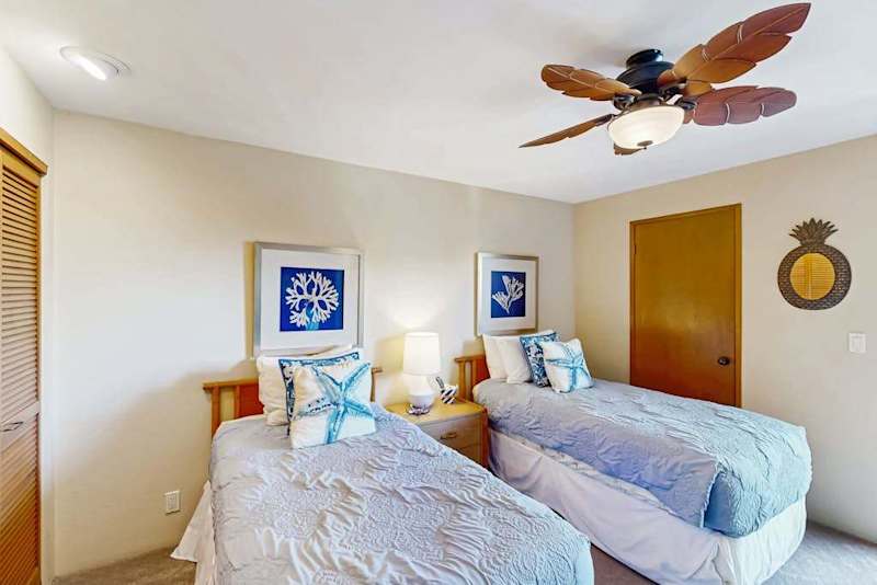 Bright Bedroom with Two Twin Beds and Tropical Ceiling Fan
