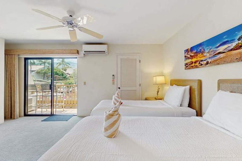 Comfortable twin beds create a welcoming sleep space for relaxing resort stays