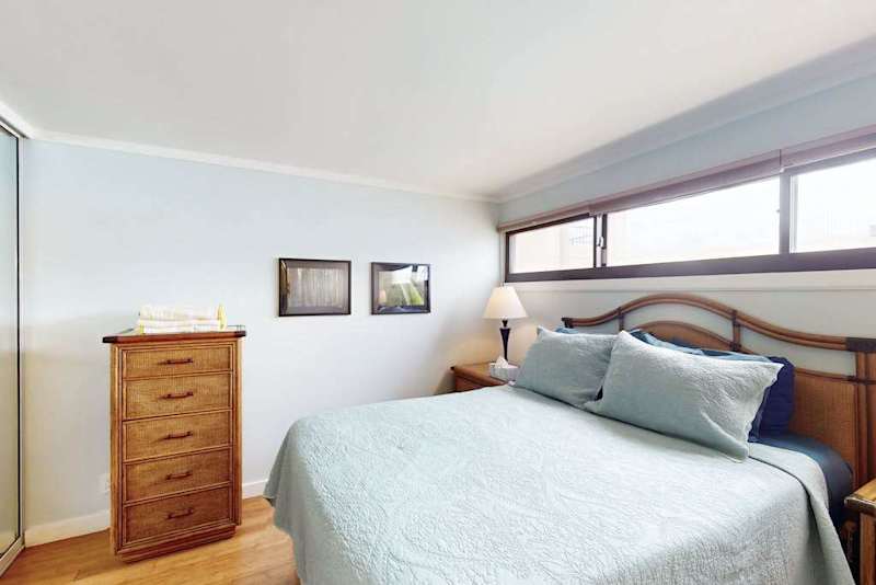 Relax in a cozy queen bedroom after a day of exploring