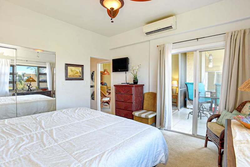 Primary suite with king bed, lanai access, plus an ensuite bathroom.