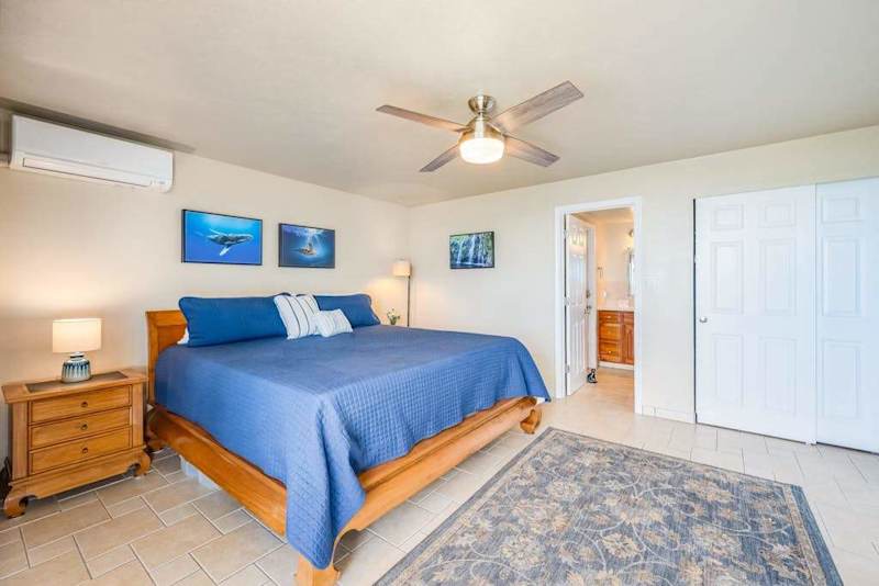 Comfortable king bedroom with ample closet space and plush bedding