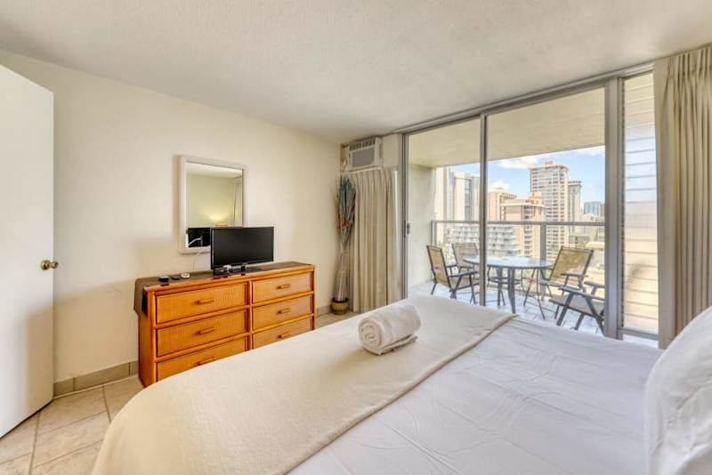 Wake up to beautiful Waikiki skyline views from the spacious king bedroom with direct access to your private lanai.
