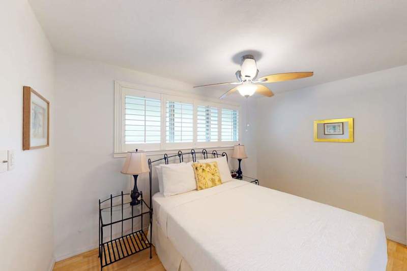 Peaceful bedroom with ceiling fan keeps the space cool and inviting every night