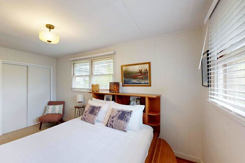 Cozy queen bed creates the perfect retreat inside the welcoming master bedroom