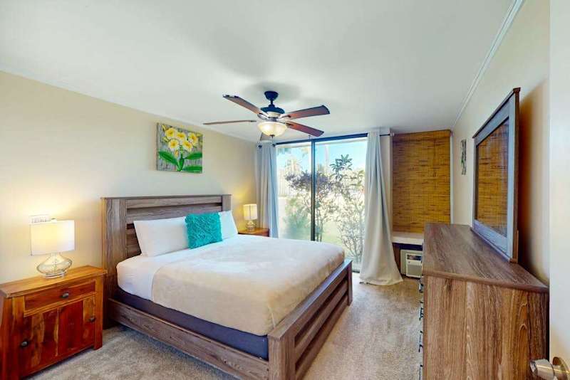A bright bedroom with warm touches that make every stay feel special