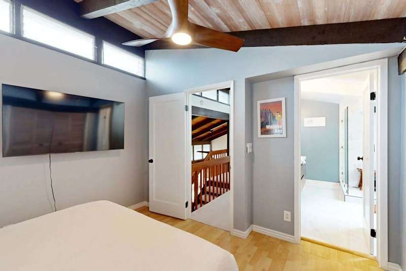 Recharge after a day out in a cool bedroom with convenient TV access.