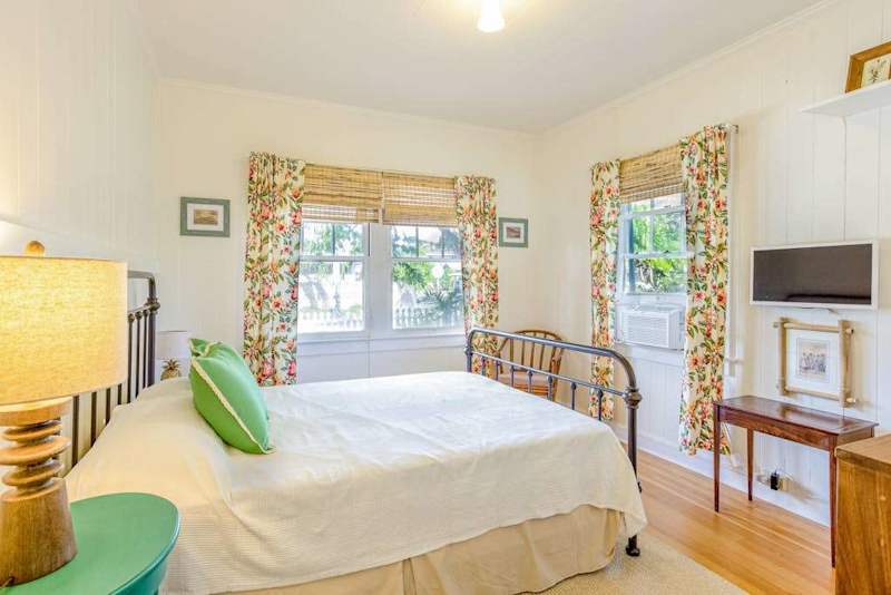 End every adventure with peaceful sleep in Cottage B's cozy queen bedroom