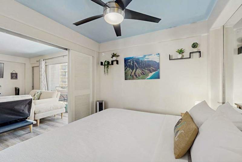 Settle into a comfortable space with a king-size bed and ceiling fan, perfect for a relaxing stay.