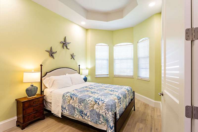 Bedroom Suite #1 with queen bed, large closet and adjoining bathroom.