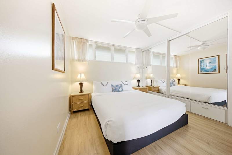 Serene Master Bedroom Retreat With Bright Mirrored Accents