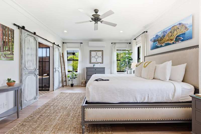 Spacious, well-lit bedroom with a king-size bed on the ground floor