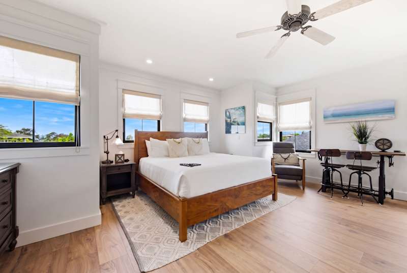 Well-lit room with a king sized bed