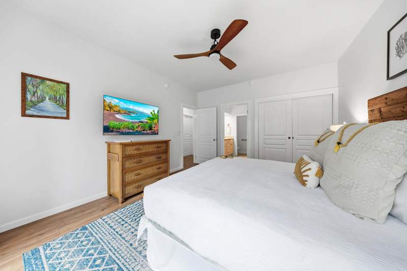 King Bedroom with TV, Dresser, and Ceiling Fan