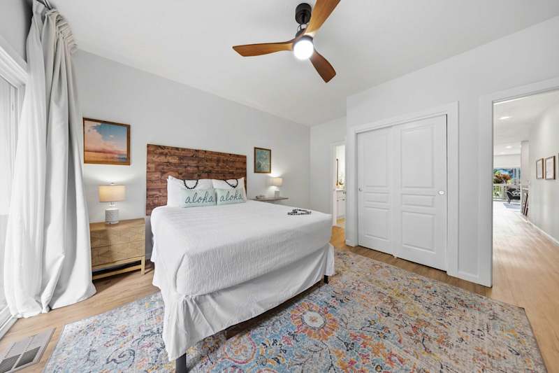 Airy Bedroom with Ceiling Fan and Closet Space