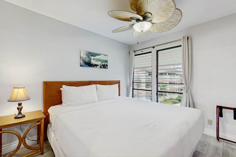 Sunlit King Guest Bedroom Retreat Featuring Custom Woven Ceiling Fan and AC