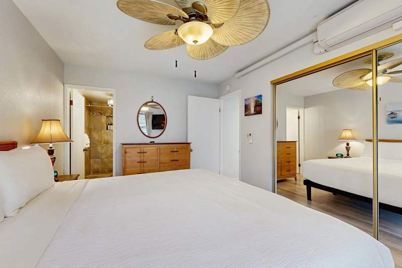 Tropical Retreat Bedroom Featuring King Bed & Island-Style Accents and A/C