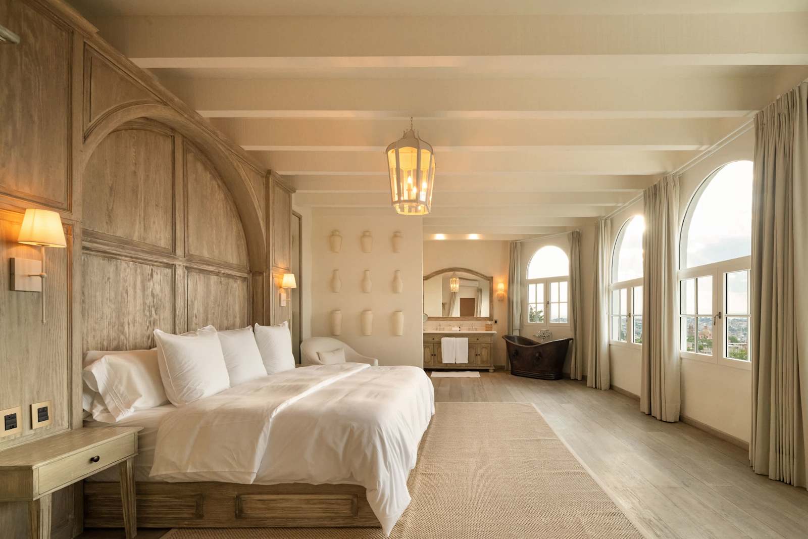 Suite 4: King bed, ensuite bathroom with shower and copper soaking tub, city and church views