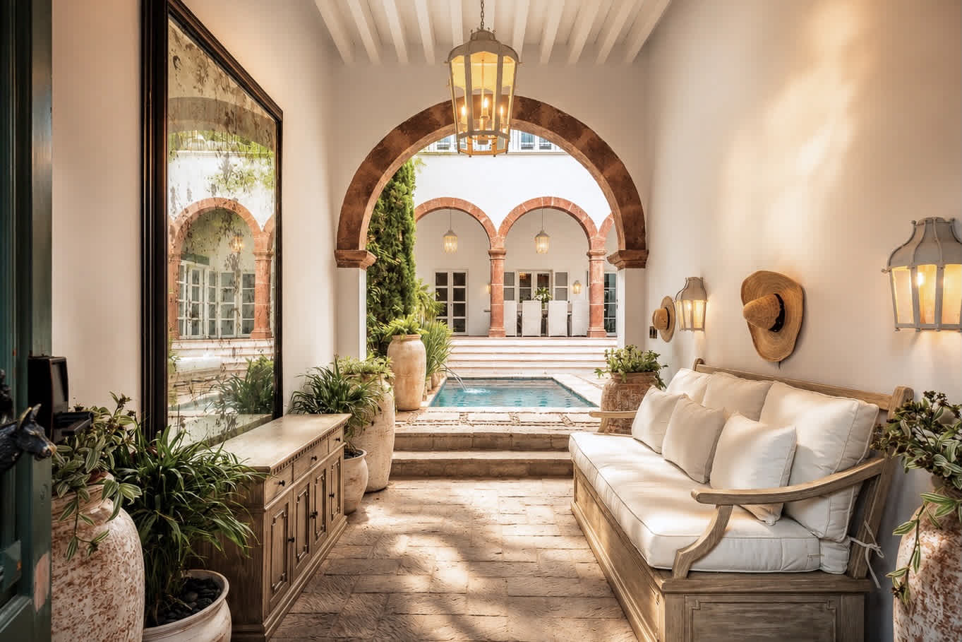 Covered lounge area overlooking the courtyard and pool