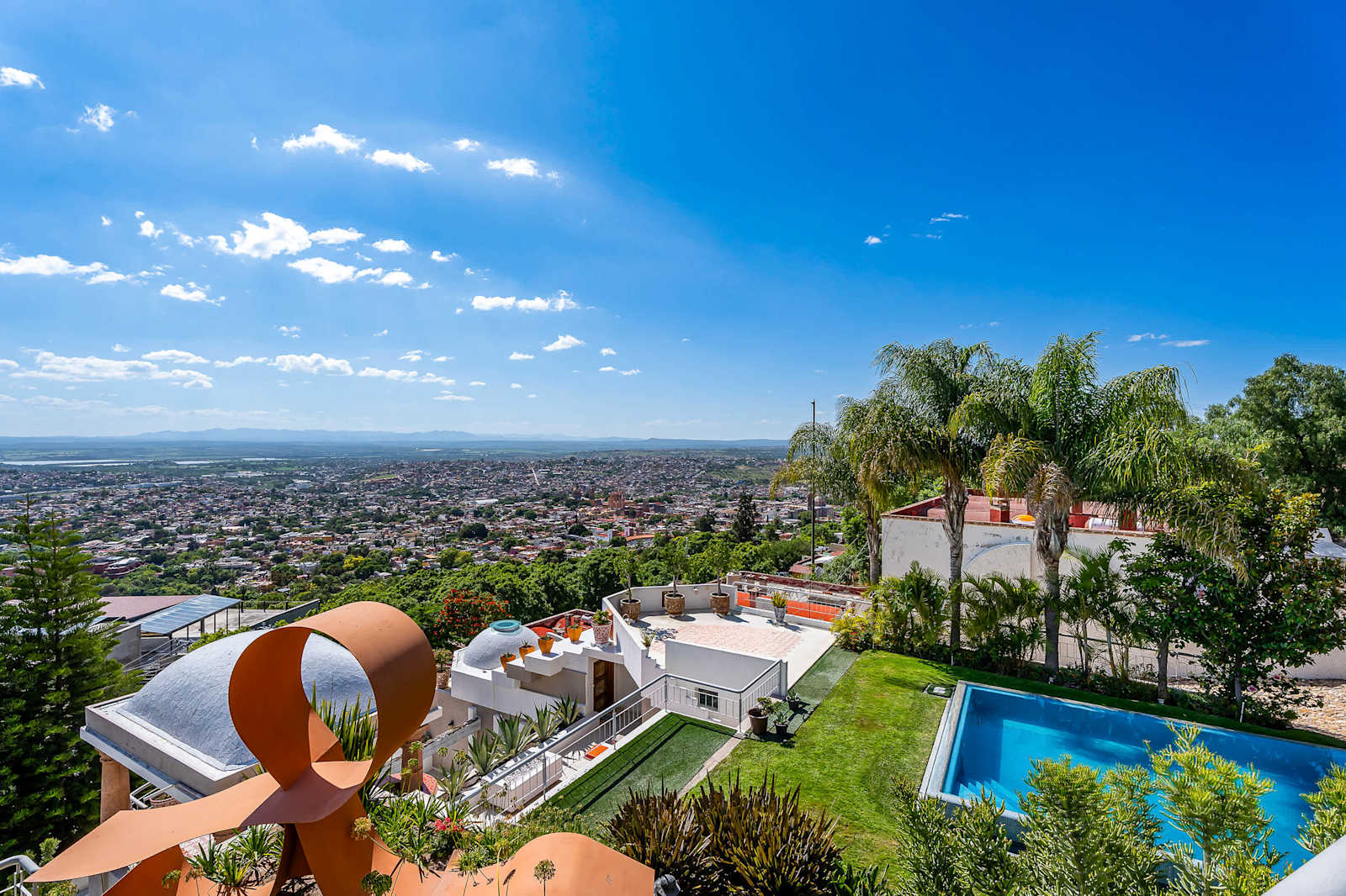 Shared outdoor infinity pool with panoramic views of San Miguel de Allende