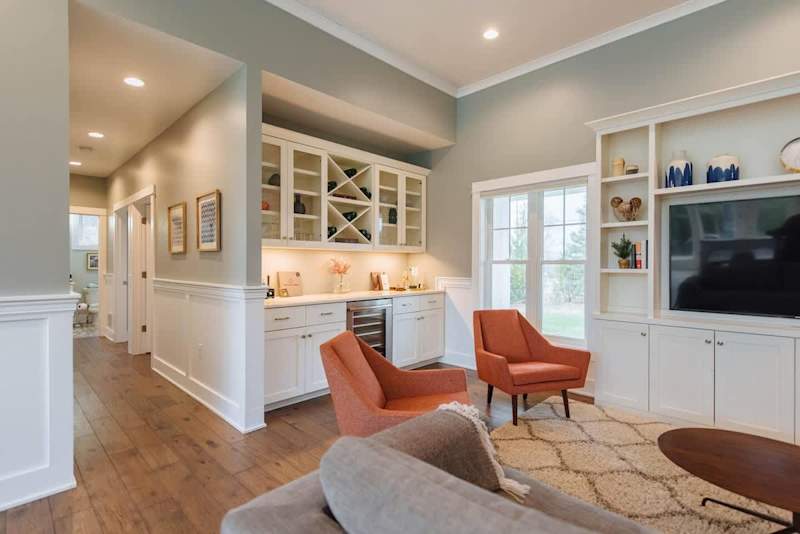 Sip, Relax, and Enjoy: Our dry bar and wine fridge, seamlessly integrated into the main living area, offer the perfect spot for entertaining or unwinding after a day exploring Door County. With ample storage for your favorite beverages and glassware,