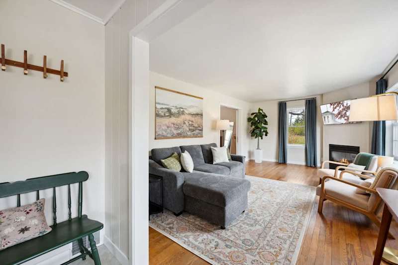An inviting living room with Smart TV, cable, board games, and an indoor fireplace for relaxed evenings in.