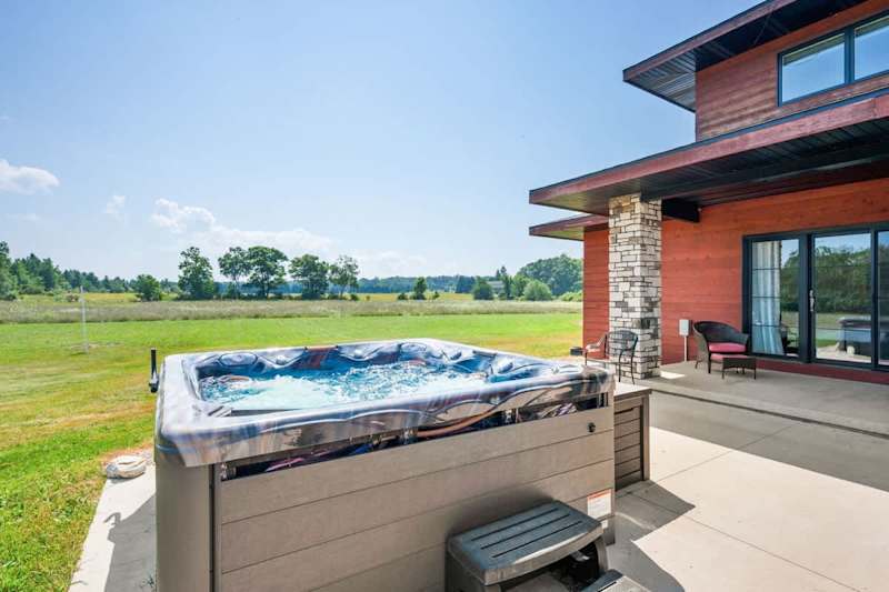 This luxury Door County retreat features a private hot tub and is located in a certified dark sky region-perfect for stargazing. On clear nights, you might even catch the northern lights or a meteor shower.