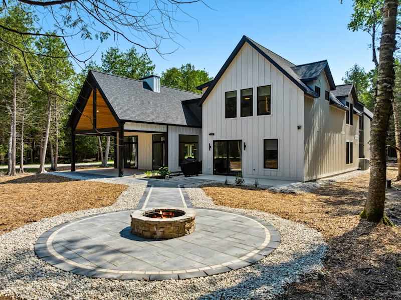 With a spacious patio, fire pit, EV charger, and elevated finishes throughout, Point Beach offers comfort, connection, and relaxation in the heart of Door County.