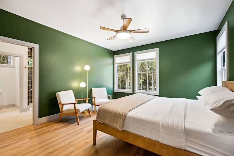 Primary Master bedroom with king bed and large en suite with shower and soaking tub.