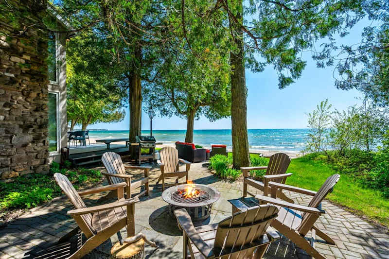 Encircled by Adirondack chairs, the outdoor first pit invites guests to enjoy balmy evenings under the stars, share stories, or simply relax to the rhythmic sounds of the waves. It's an idyllic end to any day spent exploring Door County.