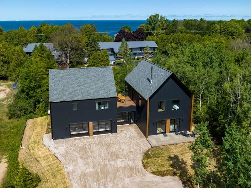 Welcome to the Nordica House and Loft, a modern and design-driven retreat located in the heart of Egg Harbor. This spacious property features a den, 5 bedrooms, 4 bathrooms, and offers a perfect balance of style and guest comfort.