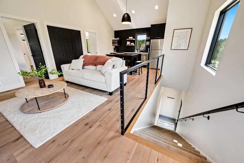 Introducing the Nordica Loft, a stylish retreat located above the garage of the main home. Located in the heart of Egg Harbor, this separate apartment offers 2 bedrooms and one bathroom, providing a private and comfortable space. Connected to the main house by an upper breezeway and deck, the loft is rented separately, ensuring privacy and exclusivity. Experience contemporary elegance with modern furnishings, fast WiFi, a well-equipped kitchenette, and a cozy seating area.