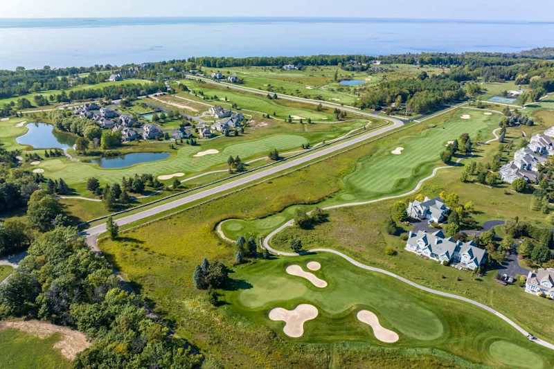 Experience the ultimate convenience and relaxation at our Club Cottages, nestled within the enchanting Horseshoe Bay Golf Club. Our exclusive collection boasts five elegant 2-bedroom, 2-bathroom condos, each featuring a cozy fireplace and a whirlpoo