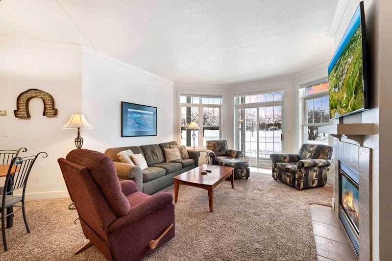 Relax in cozy comfort with an indoor fireplace and sleeper sofa for additional guests. Enjoy views of the grounds and outdoor seating on your own private deck/patio.