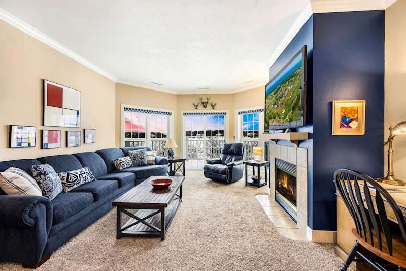 Relax in cozy comfort with an indoor fireplace and sleeper sofa for additional guests. Enjoy views of the grounds and outdoor seating on your own private deck/patio.