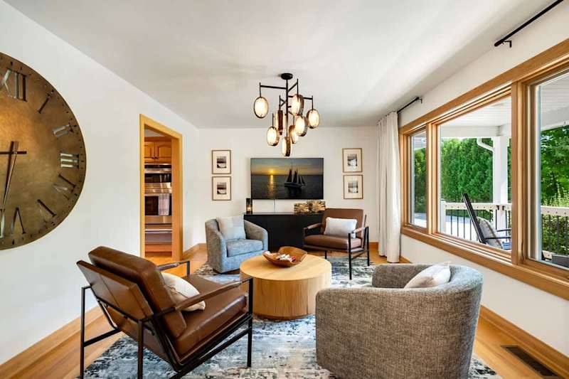 Indulge in pure relaxation and comfort as you sink into plush cushions, enveloped by natural light and the cozy ambiance of our sitting room.