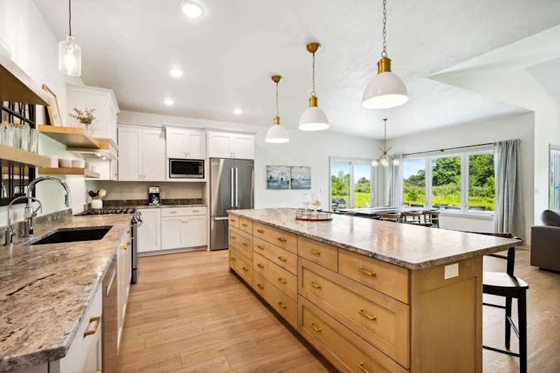 The large eat-in kitchen has all the essentials for preparing meals and snacks, and its open design makes it easy to keep the conversation going.