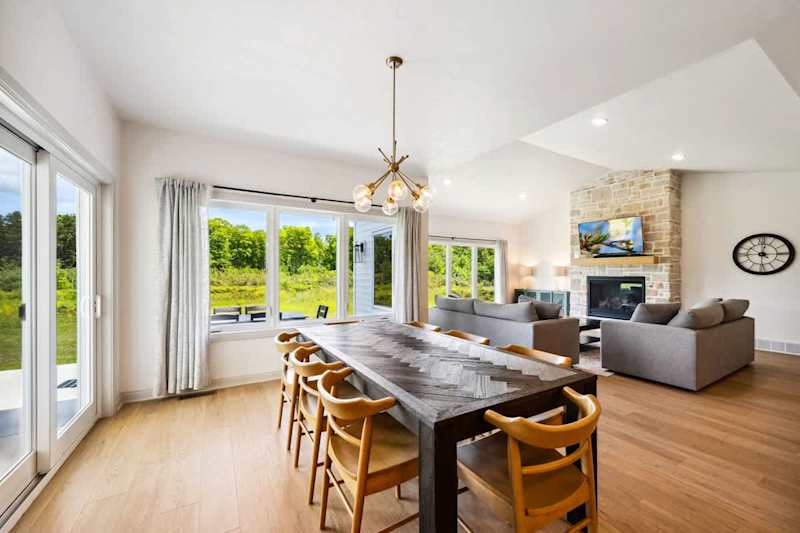 The main living area features a bright and airy open-concept design-a space that invites connection whether you’re cooking, lounging, or gathering for meals.