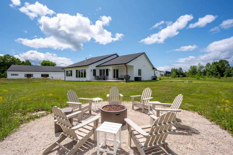 Welcome to Orchard View Retreat, a newly built modern 3 bedroom/2.5 bathroom farmhouse tucked along the edge of The Orchards Golf Course in Egg Harbor.