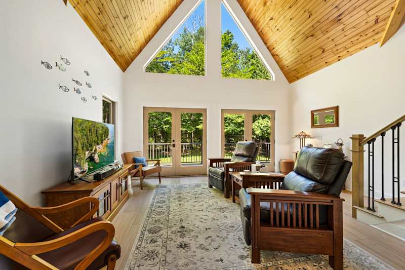 The main level features a light-filled living area where everyone can gather after a day of exploring Door County.