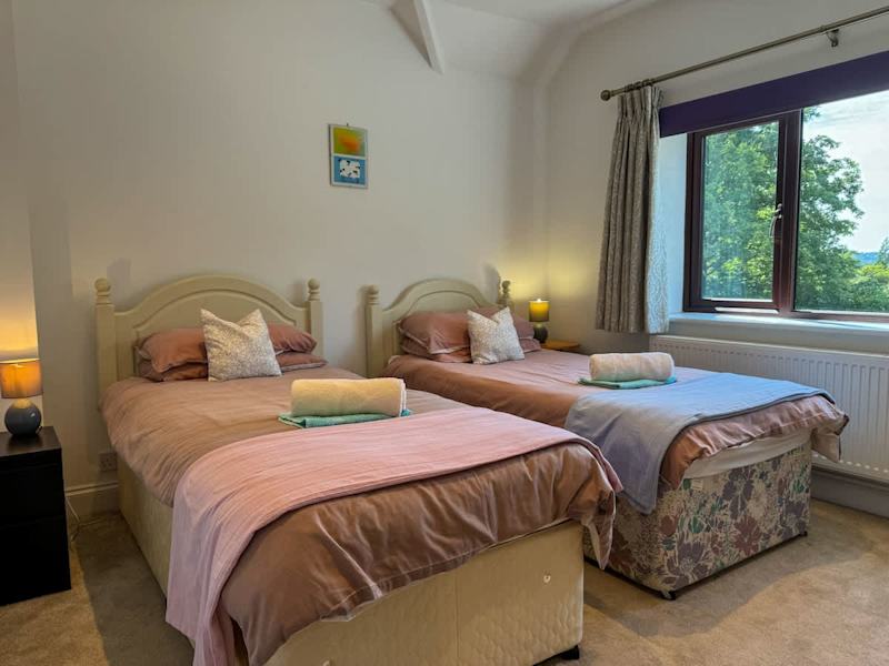 A bedroom made up with fresh linen