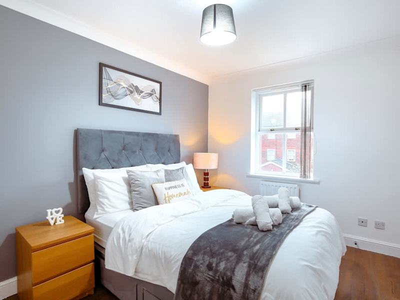 A double bedroom made up with fresh linen